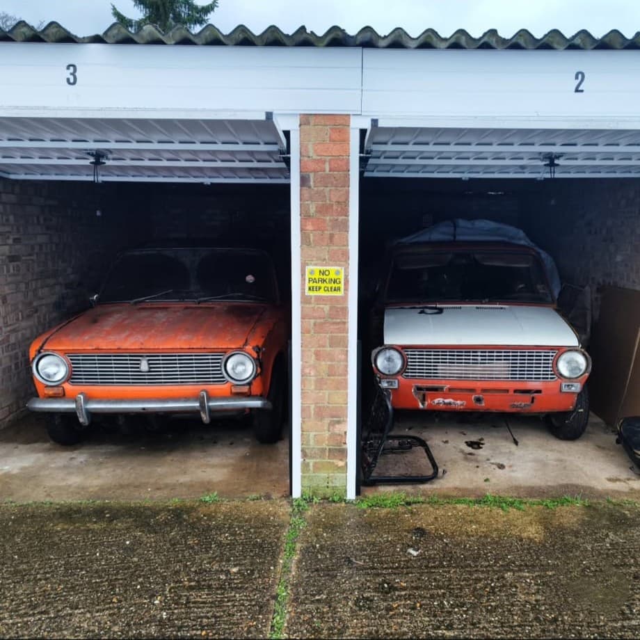Two orange Lada 2101 personal restoration and EV development cars